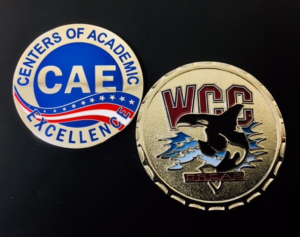 Challenge coins minted with CAE and Whatcom Community College imagery